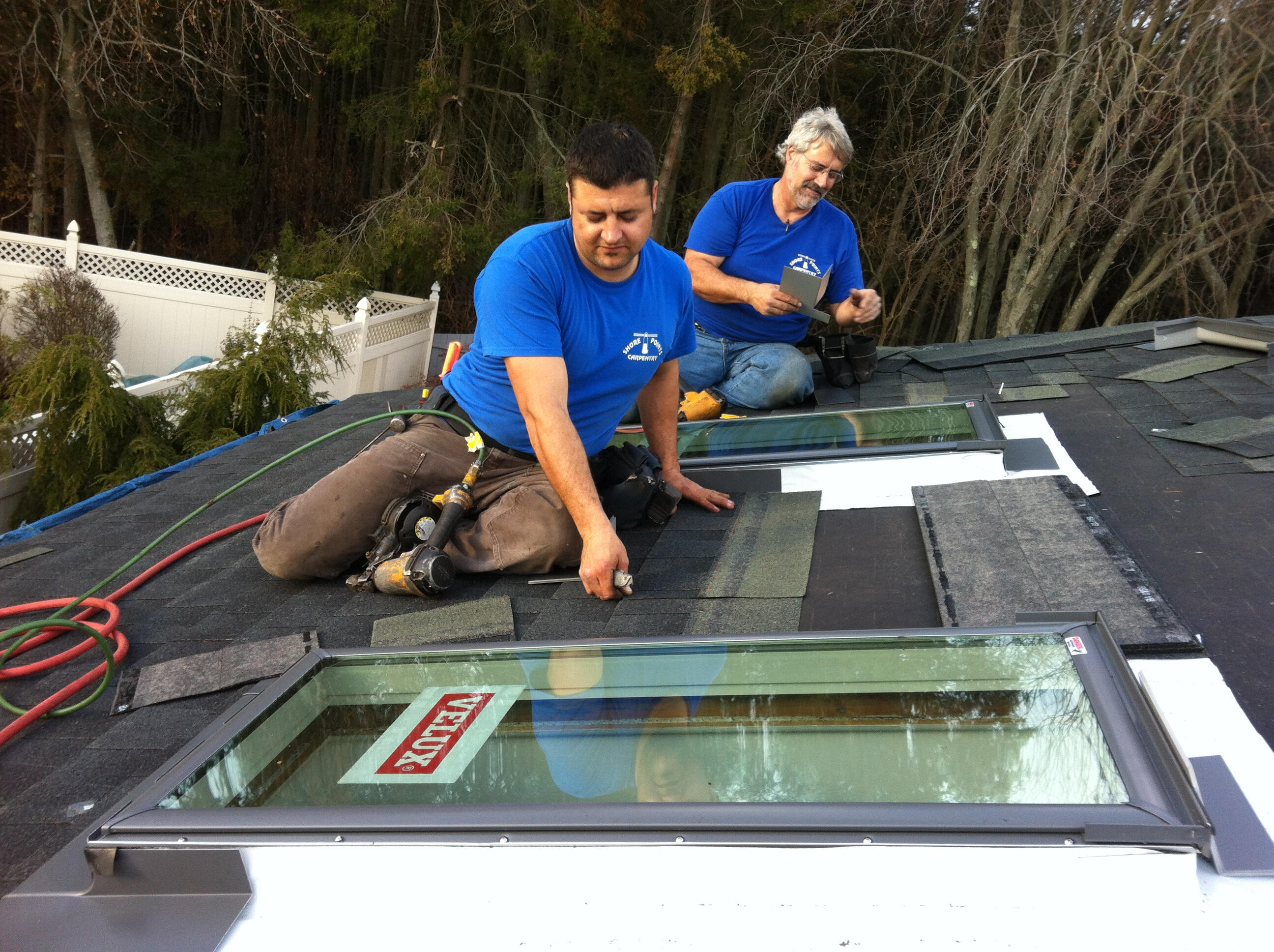 Larry and his son installing Velux skylights